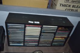 Rack Containing Various CDs