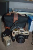 Nikon and Olympia Cameras and a Bag