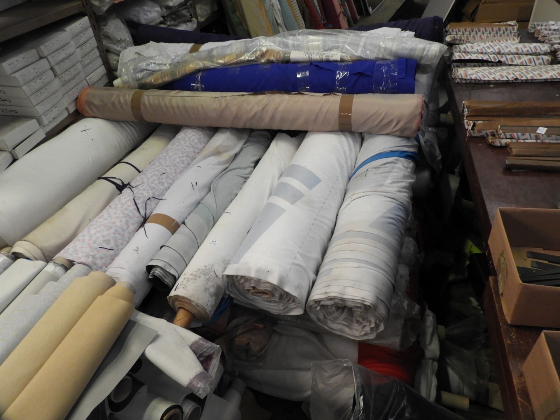 Large Quantity of Assorted Fabrics in Various Colo