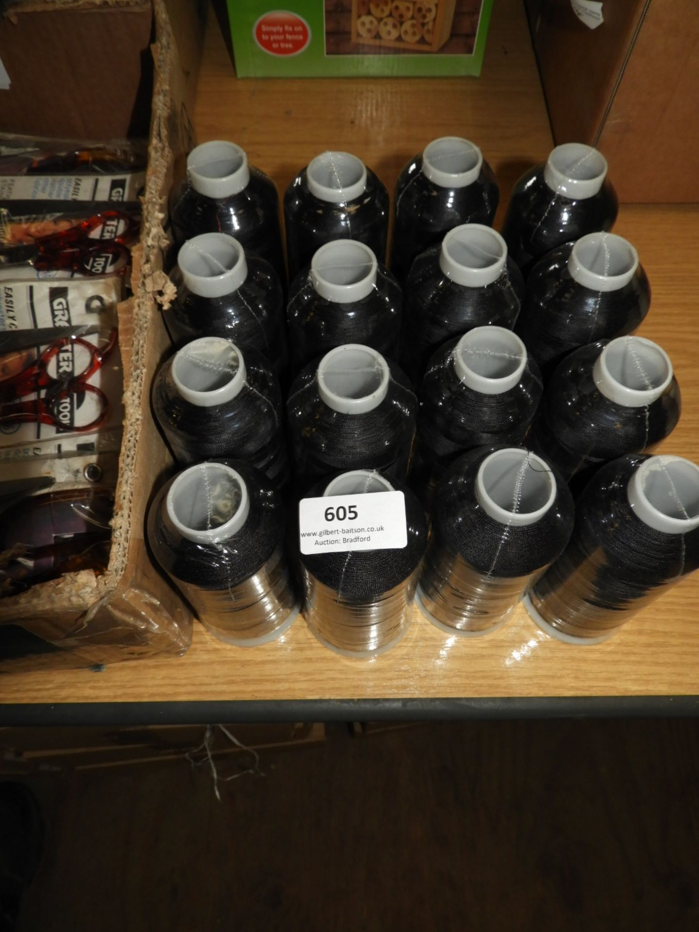 Sixteen Rolls of Black Thread