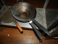 *Two Black Iron Woks and a Skillet