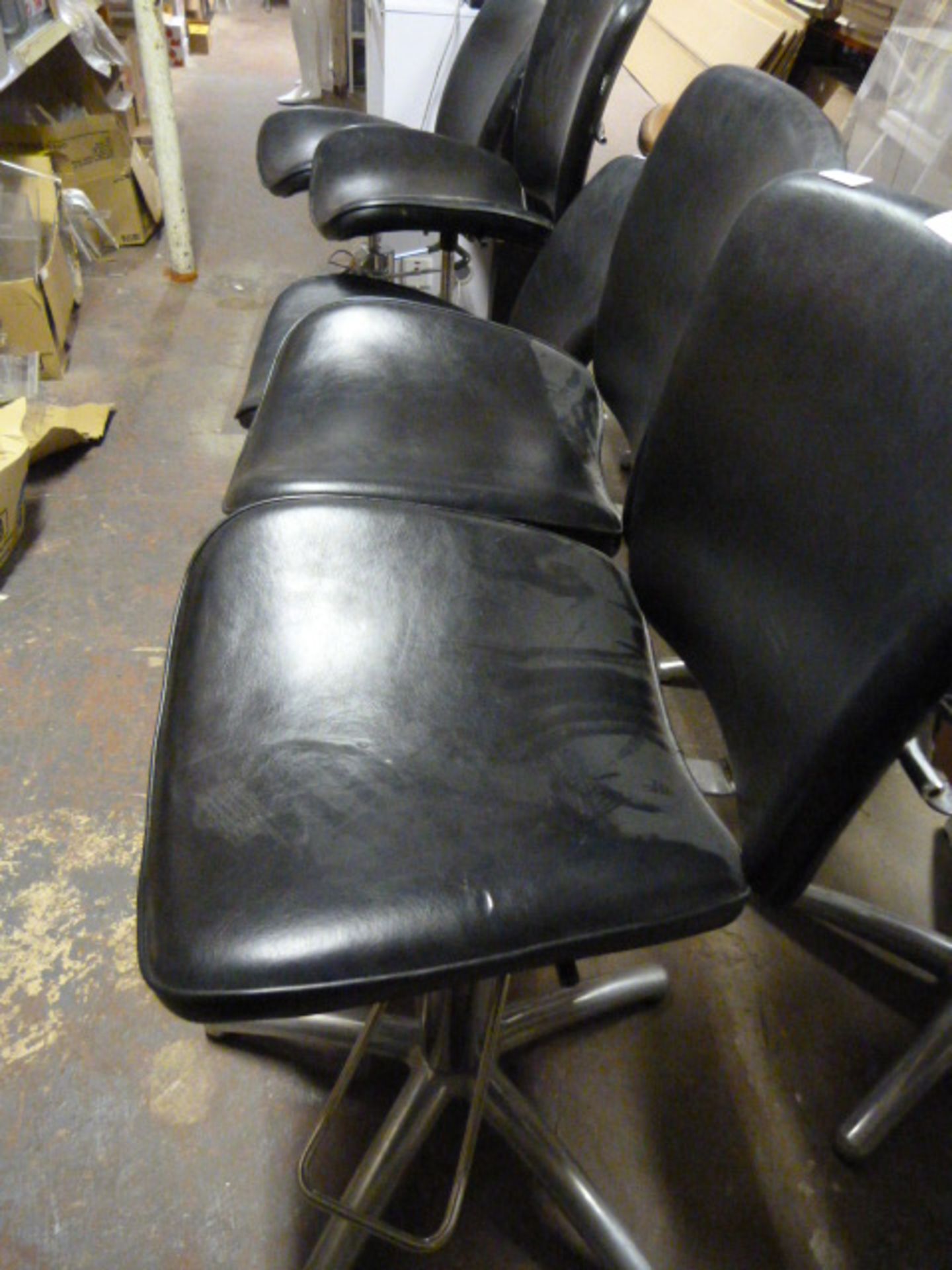 Five Black Hair Salon Chairs