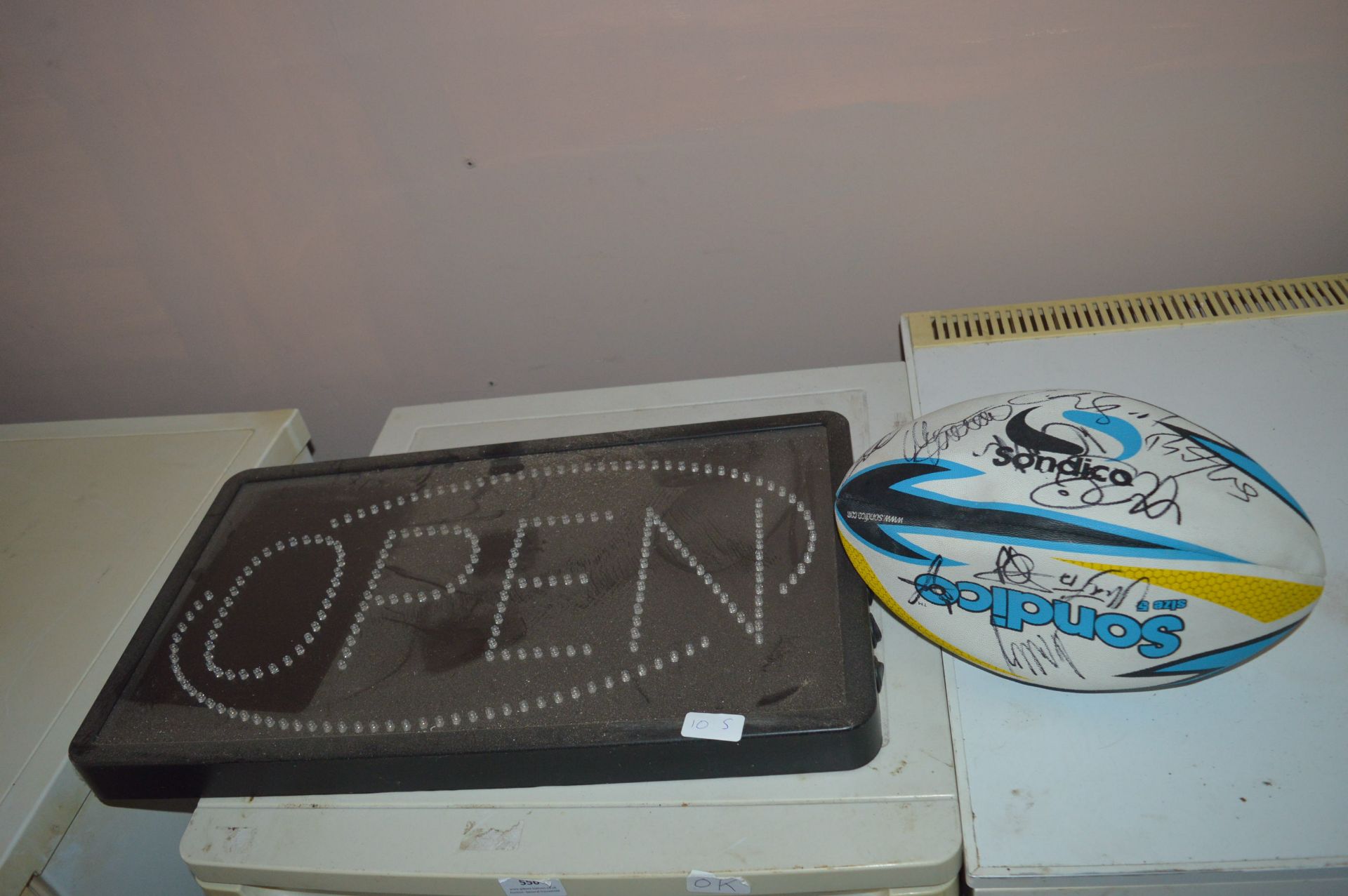 Open Sign and a Signed Rugby Ball