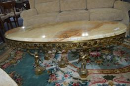 Oval Marble Topped Coffee Table on Brass Cherub Ba