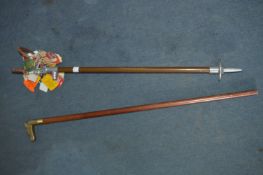 Two Walking Sticks and a Bundle Race Enclosure Tag