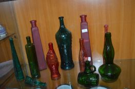 Large Collection of Coloured Glass Bottles