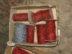 Five Red and One Silver Rolls of Tassel Wool