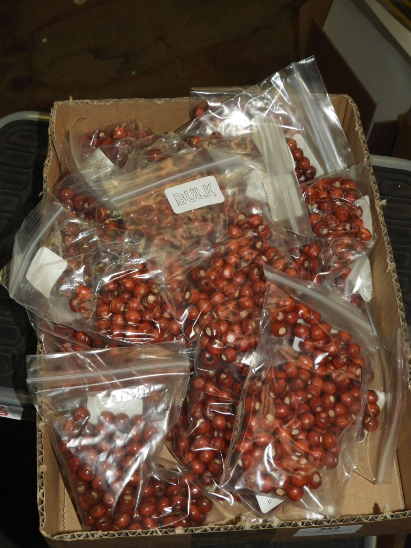 Box Containing 20 Bags of Wood Beads