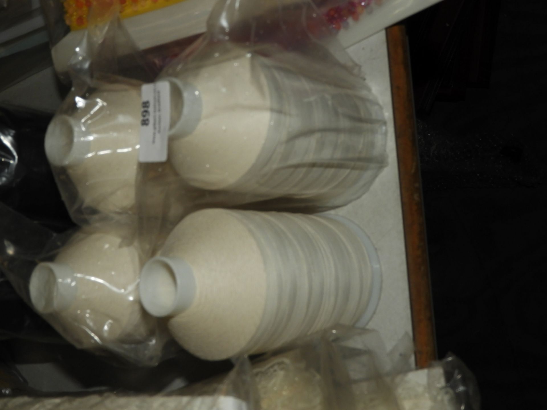 Four Rolls of Cream Sewing Thread