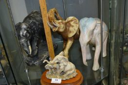Four Assorted Elephant Figurines Including Raging