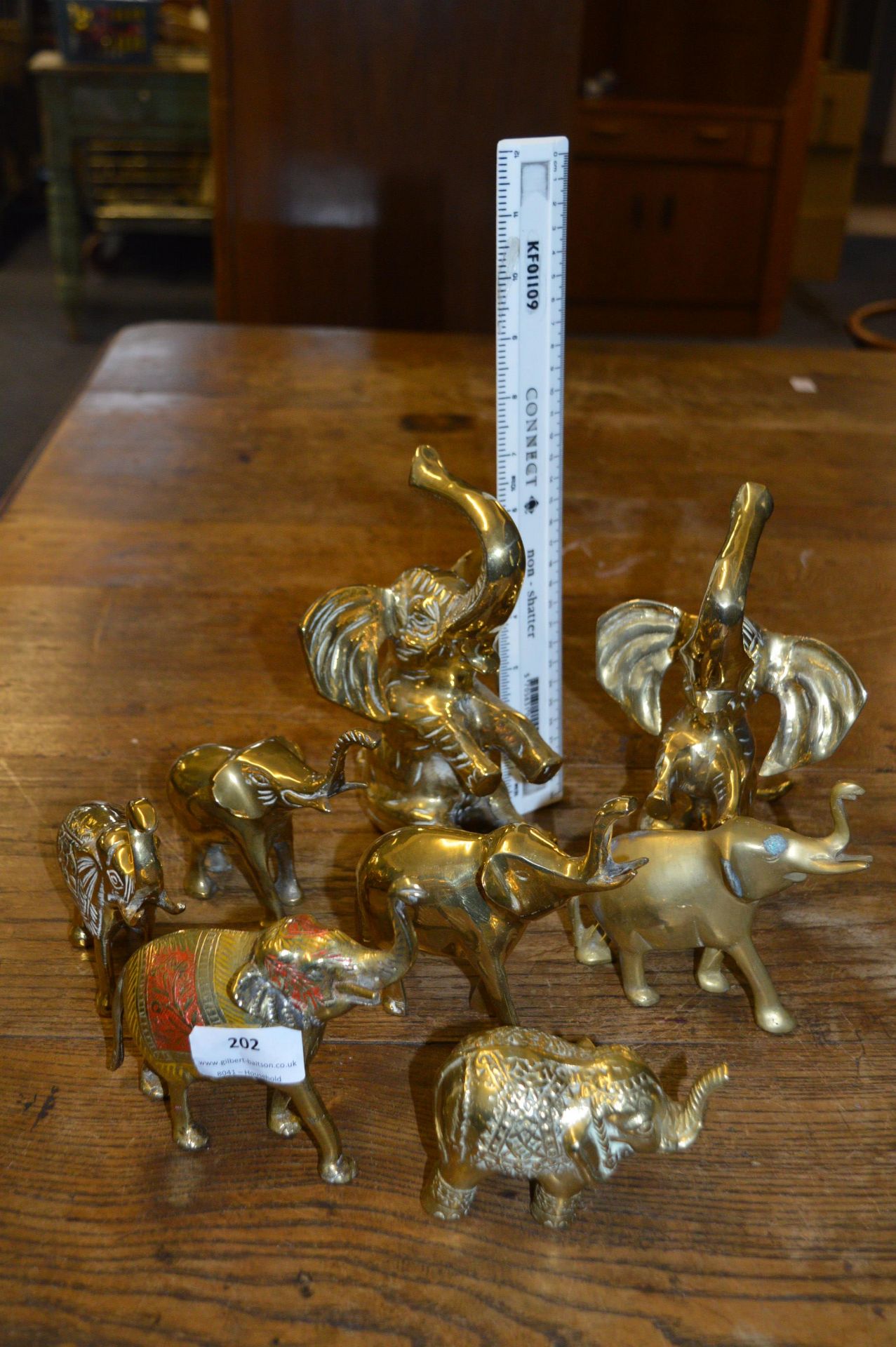 Eight Small Brass Elephants