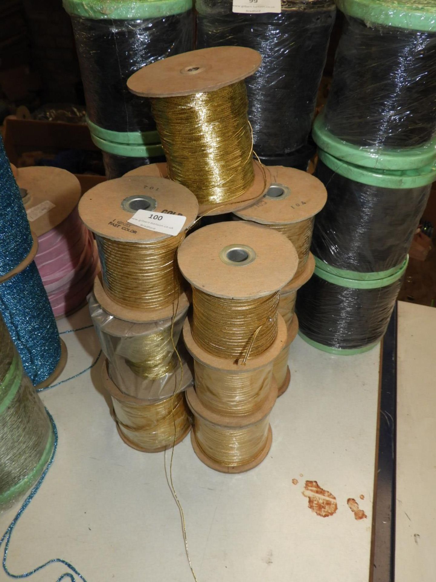 Thirteen Rolls of Gold Braided Thread