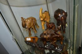 Five Assorted Elephants Including Intricately Carved Elephant Pulling a Log