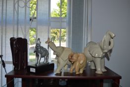 Four Carved Soapstone Elephants and One Other