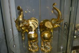 Two Large Brass Elephants and Two Other Elephants