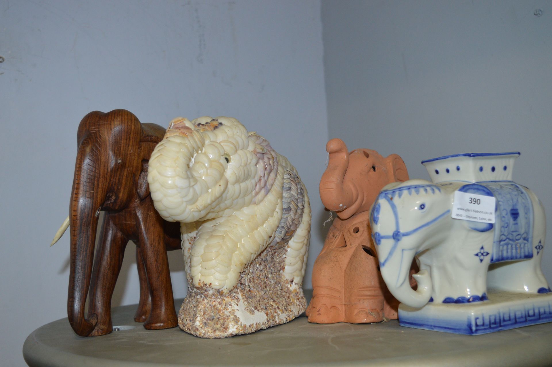 Four Assorted Elephants and One Covered in Shells