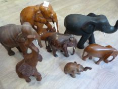 Seven Assorted Wooden Elephants