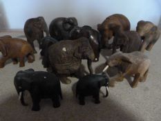 Twelve Small Wooden Elephants Including Some Ebony