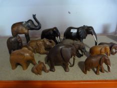 Twelve Small Wooden Elephants Including Some Ebony