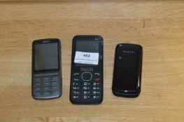Three Mobile Phones - Two Alcatel and a Nokia