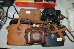 Collection of Vintage Binoculars and Cameras