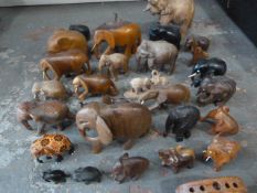 Box of Thirty Small Wooden Elephants Including Som