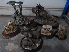 Seven Elephant Groups on Wooden Bases