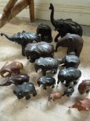 Box of Sixteen Ebony and Wooden Elephants