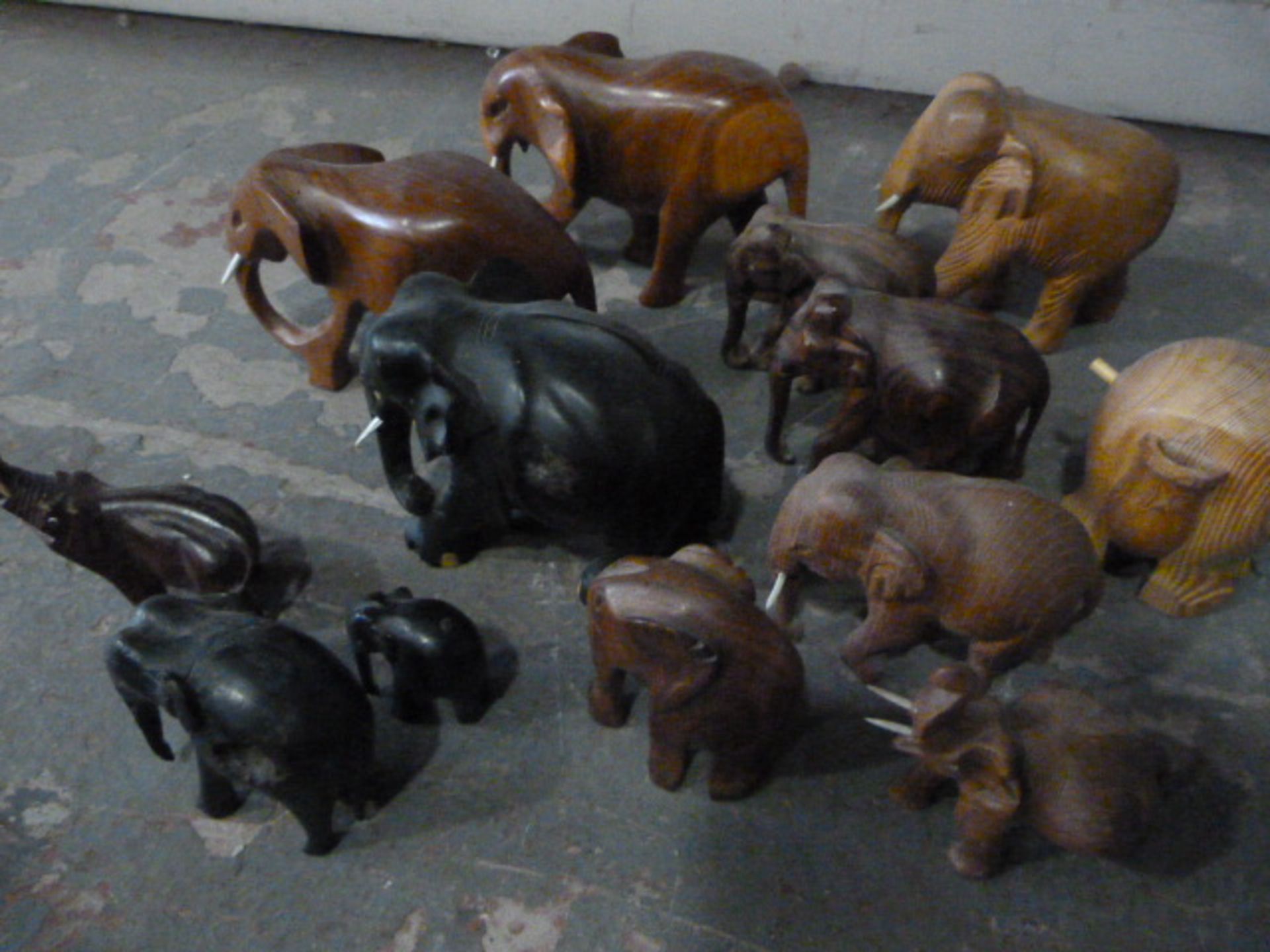 Box of Thirteen Small Wooden Elephants