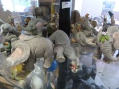 Shelf of Resin Elephants