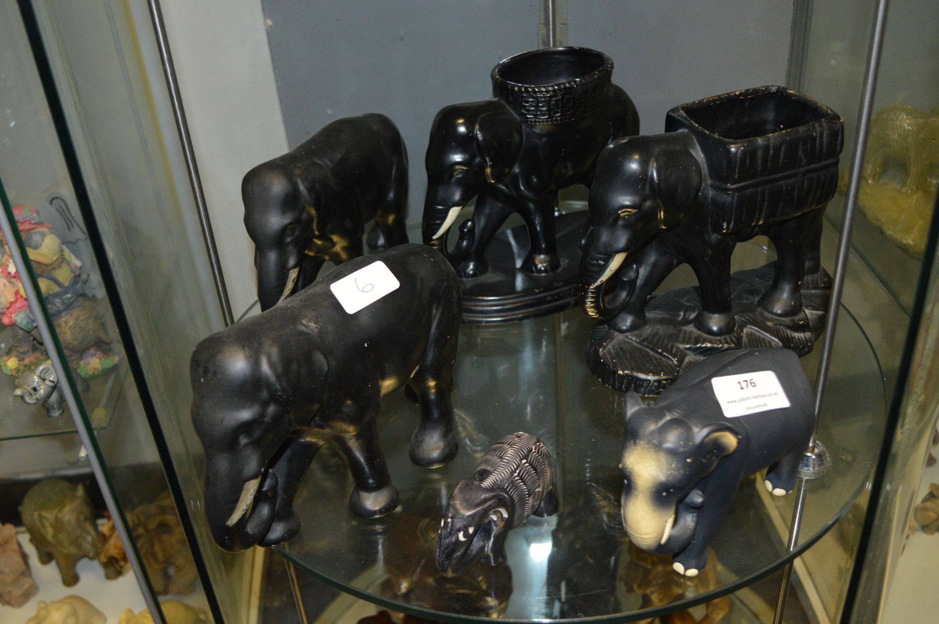 Six Black Pottery Elephants