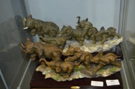 Two Groups of Running Elephants