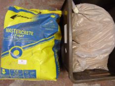 Bag of Master Crete Cement and a Bag of Fine Sand