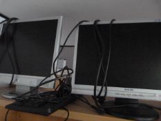 One Philips and One HP Monitors Plus a Keyboard