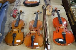 Three Violins and a Selection of Bows