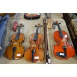 Three Violins and a Selection of Bows