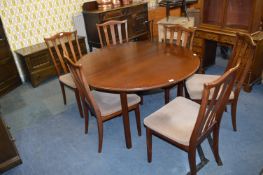 Circular Ercol Dining Table with Six Chairs