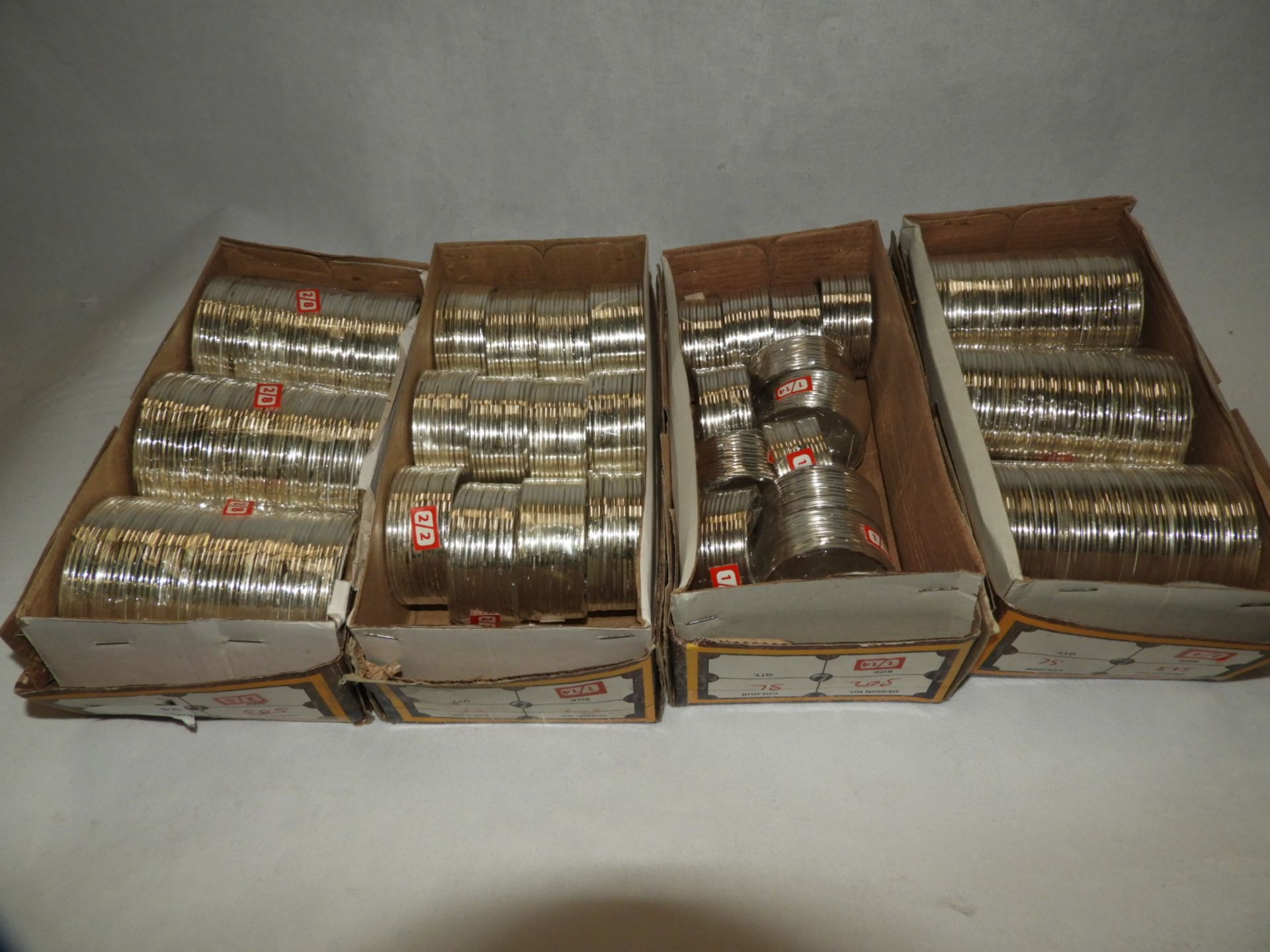 Four Boxes Containing Asian Style Bangles and Bracelets