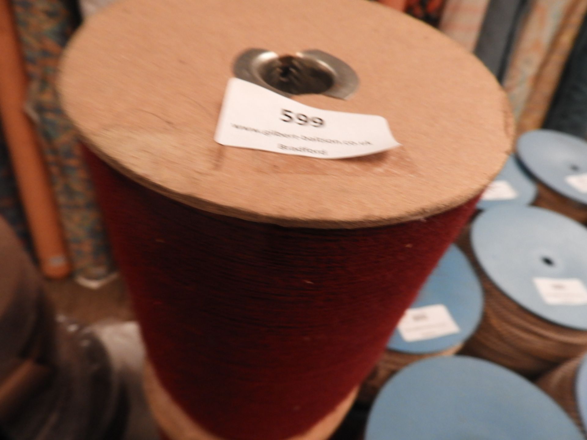 Three Rolls of Burgundy Thread