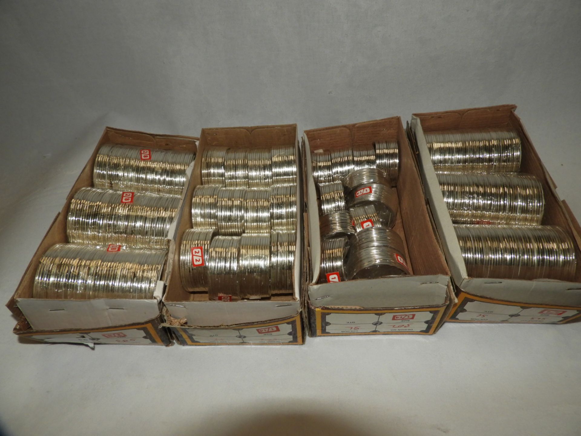 Four Boxes Containing Asian Style Bangles and Bracelets