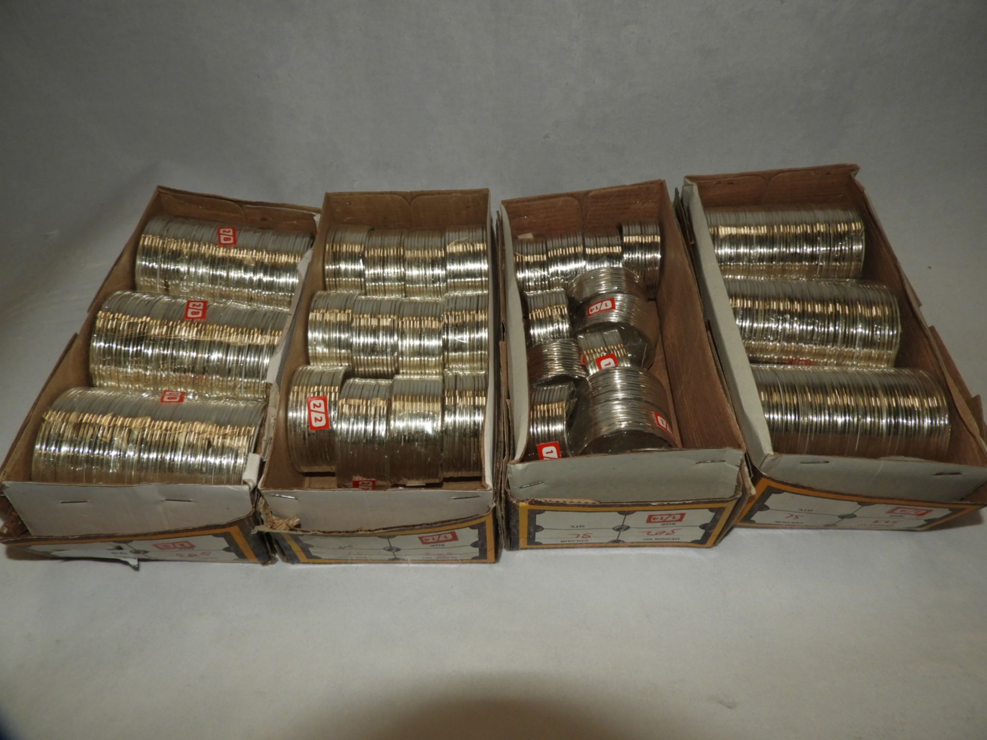 Four Boxes Containing Asian Style Bangles and Bracelets