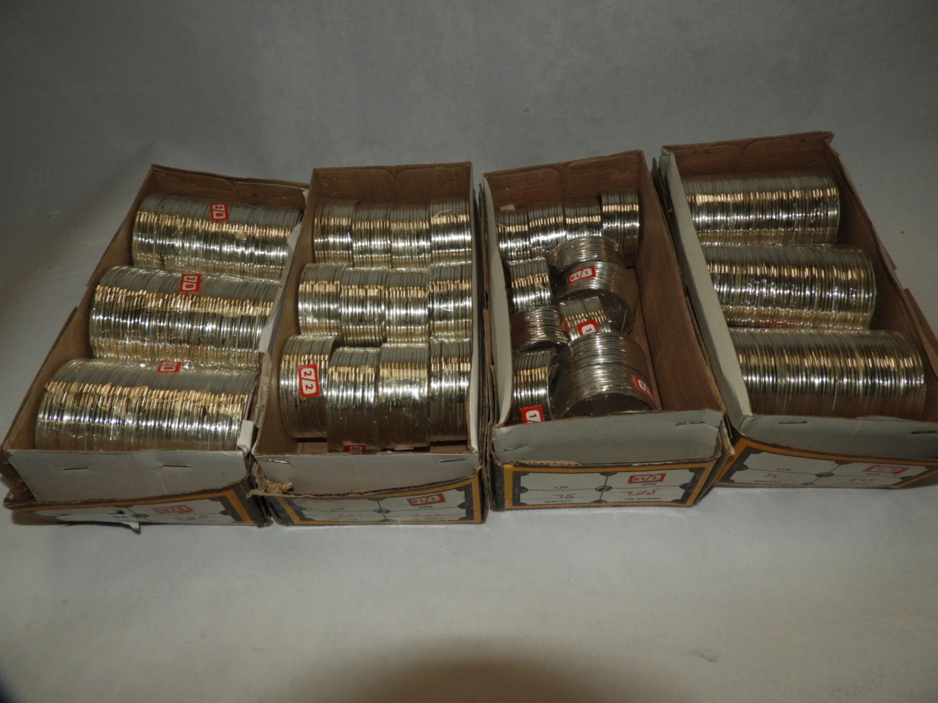 Four Boxes Containing Asian Style Bangles and Bracelets