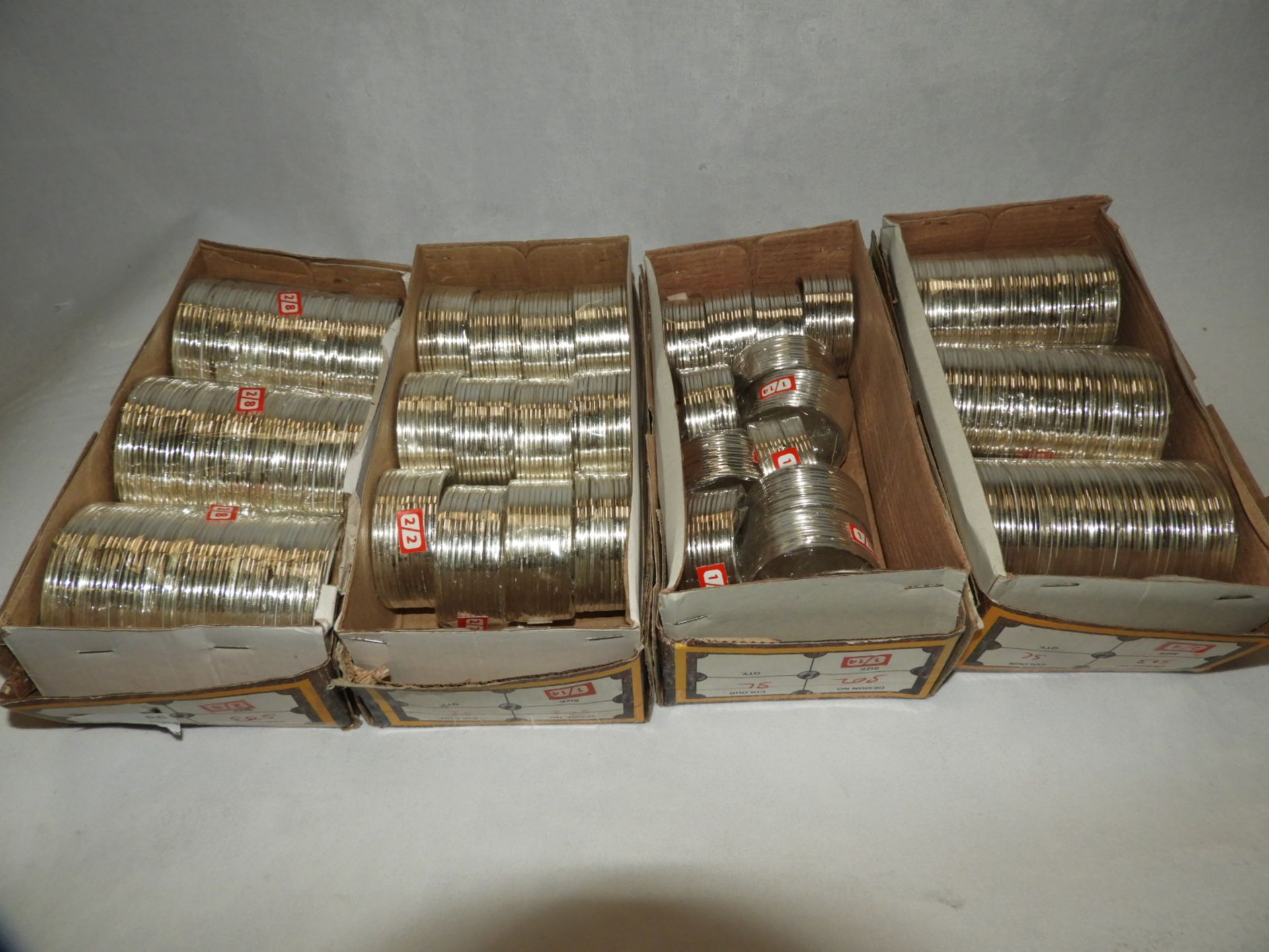 Four Boxes Containing Asian Style Bangles and Bracelets