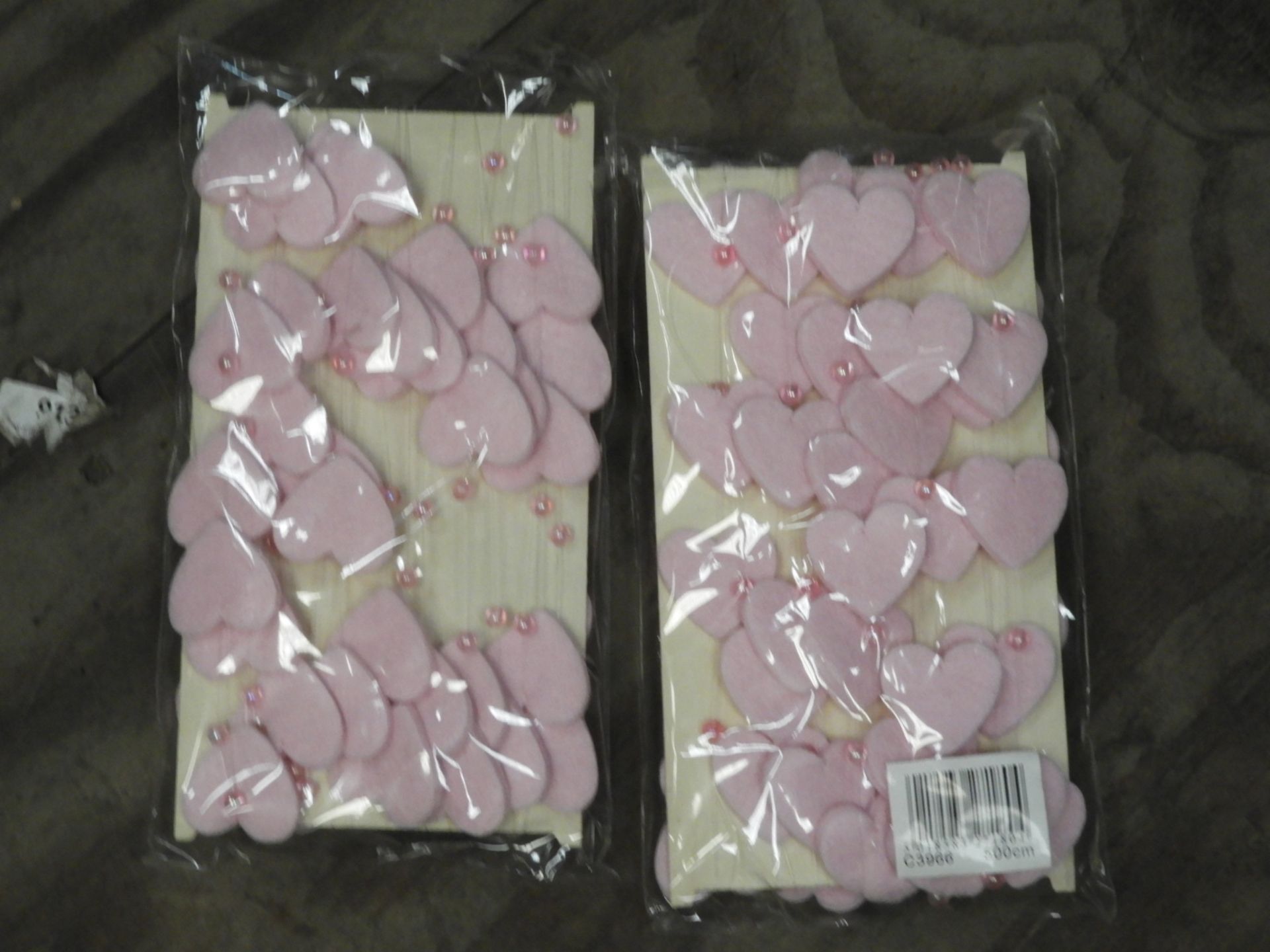 Two Boxes Containing 12 5m Lengths of Pink Heart a