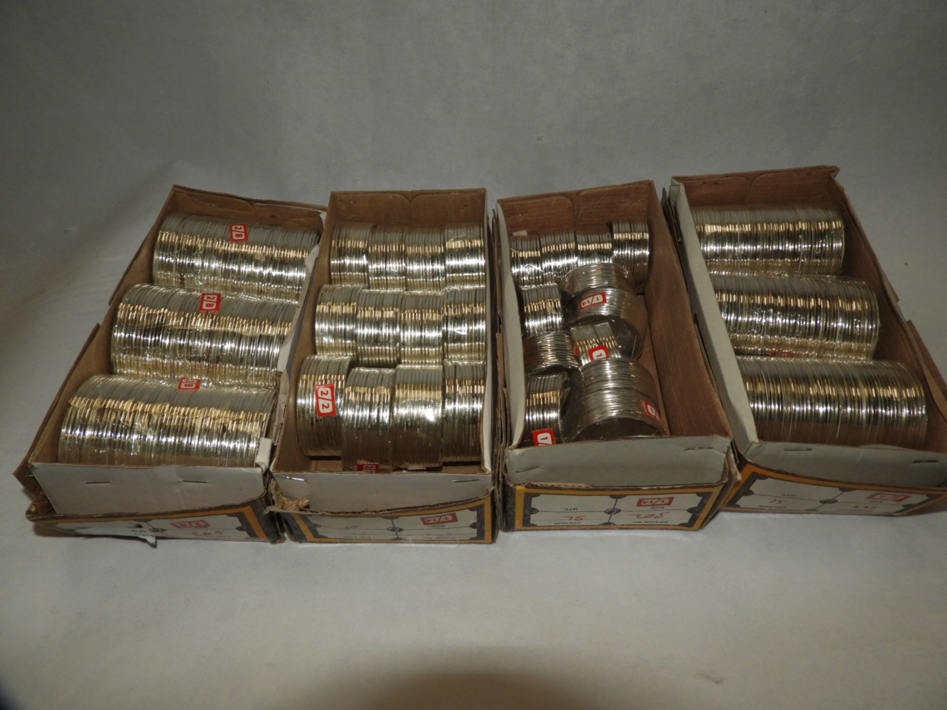 Four Boxes Containing Asian Style Bangles and Bracelets