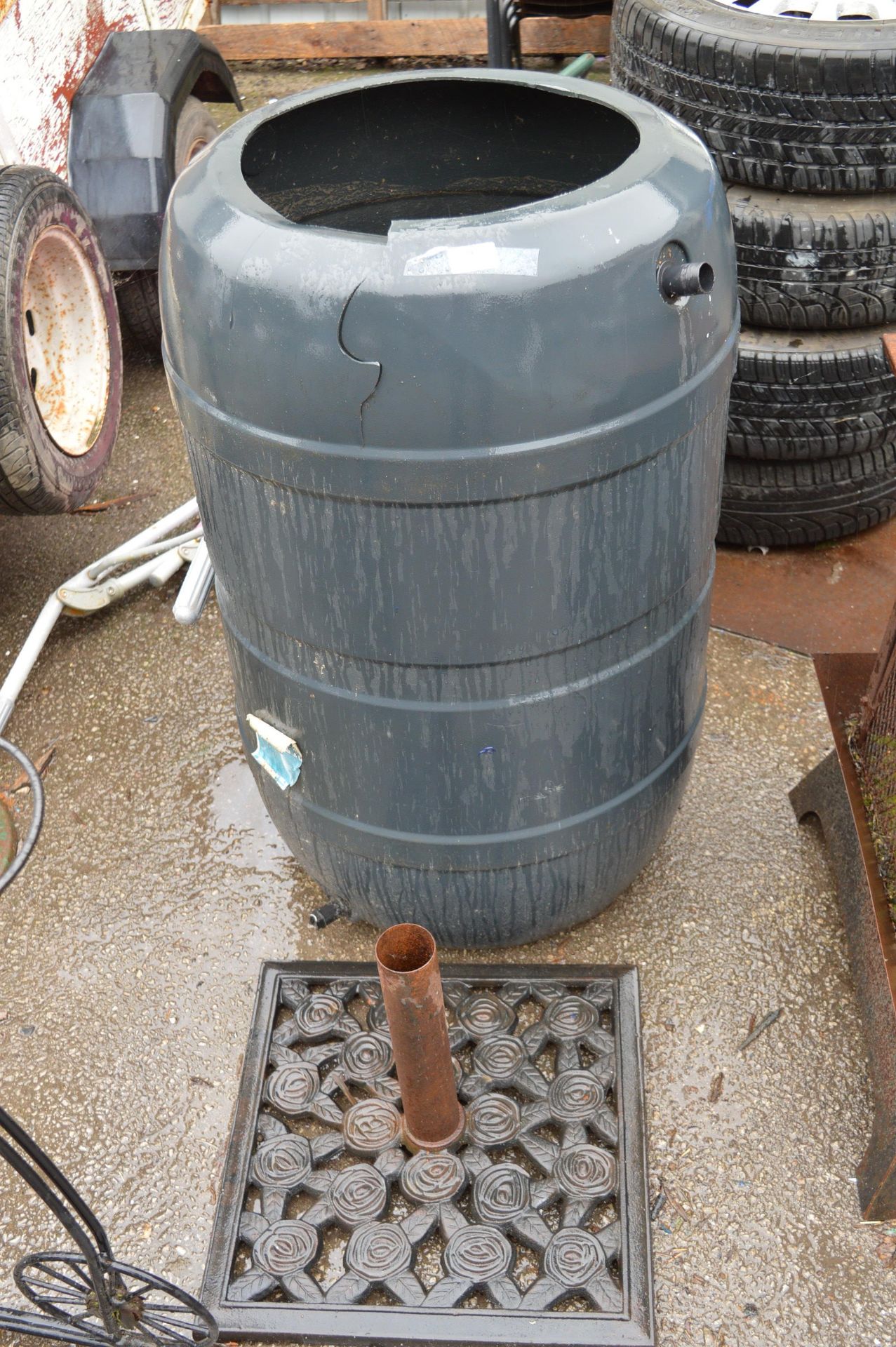 Plastic Water Butt and a Cast Iron Parasol Stand