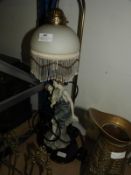 Decorative Table Lamp Featuring a Figurine of a Mo