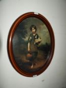 Oval Framed Print - Boy Holding Spaniel Puppy