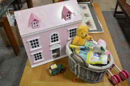 Basket Containing Children's Toys and a Pink Dolls