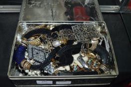 Tin Containing a Collection of Costume Jewellery